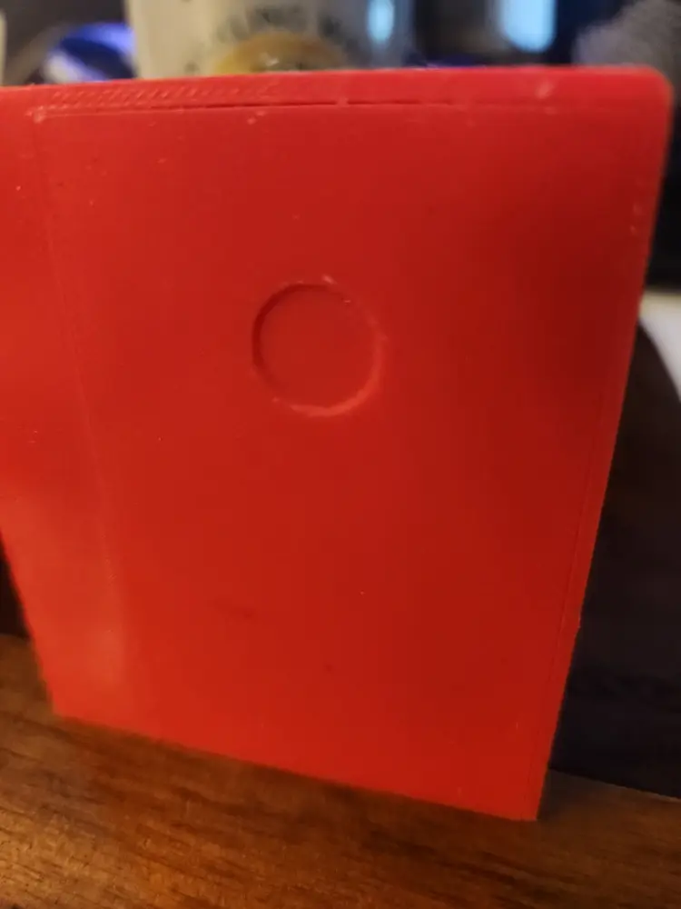 The small round indent is where you will want to place the magnet.